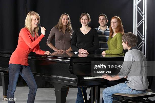 female singer, chorus, pianist and grand piano - choir stage stock pictures, royalty-free photos & images