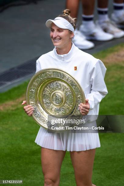 Marketa Vondrousova of the Czech Republic with the winner's trophy after her victory against Ons Jabeur of Tunisia in the Ladies' Singles Final match...