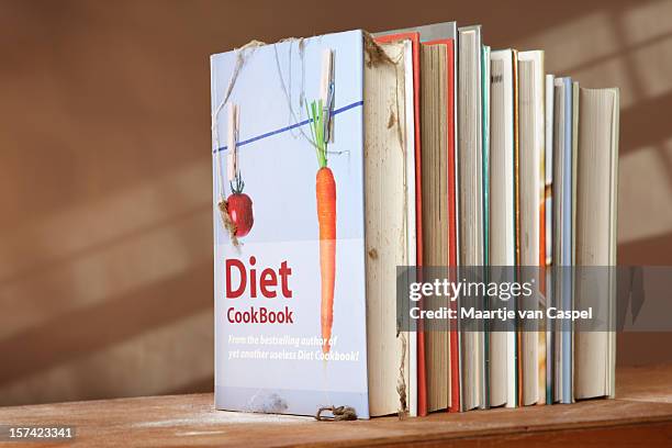 diet cookbook on shelf with other books - cookbook stock pictures, royalty-free photos & images