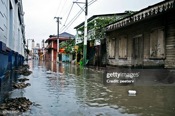 flooded alley - puerto plata (city) stock pictures, royalty-free photos & images