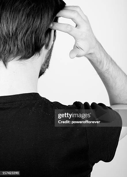 dandruff - man scratching stock pictures, royalty-free photos & images