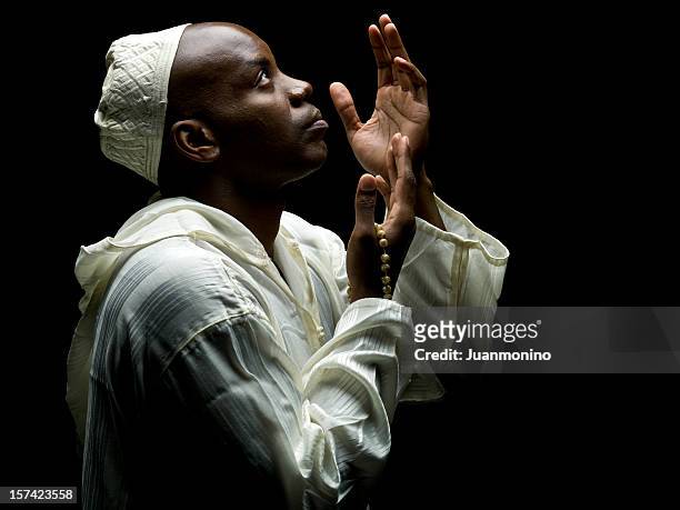 sudanese muslim man praying - djellaba stock pictures, royalty-free photos & images