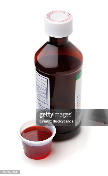 cough syrup or cold medicine - syrup stockfoto's en -beelden