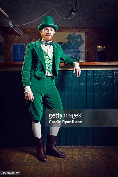 irish character / leprechaun standing in a pub - tail coat stock pictures, royalty-free photos & images