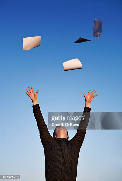 young businessman throwing paper in air, blue sky - throwing paper stock pictures, royalty-free photos & images