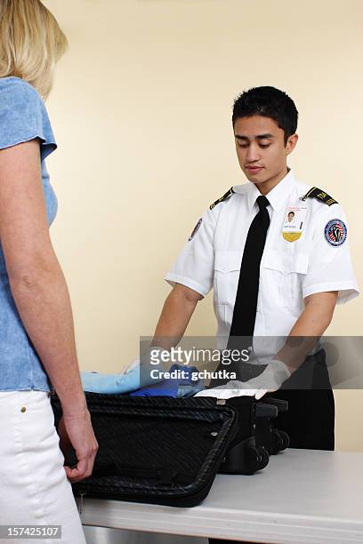 luggage inspector - airport security stock pictures, royalty-free photos & images