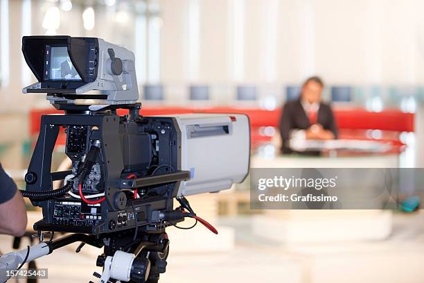 newsreader in front of television camera - television studio stock pictures, royalty-free photos & images