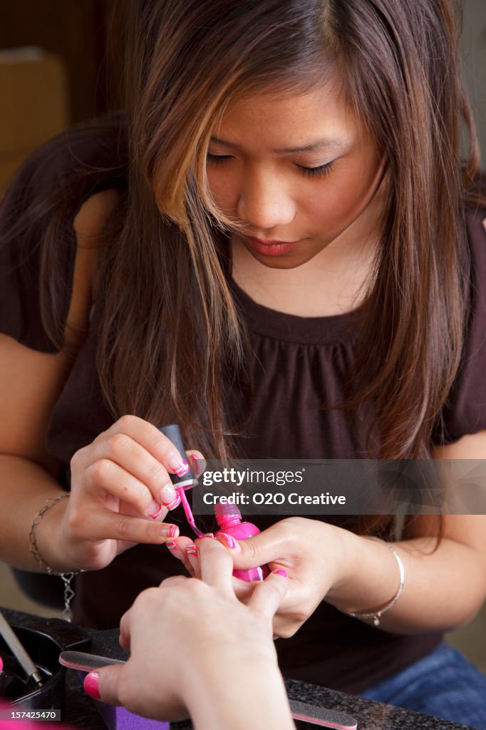 Woman Giving a Manicure