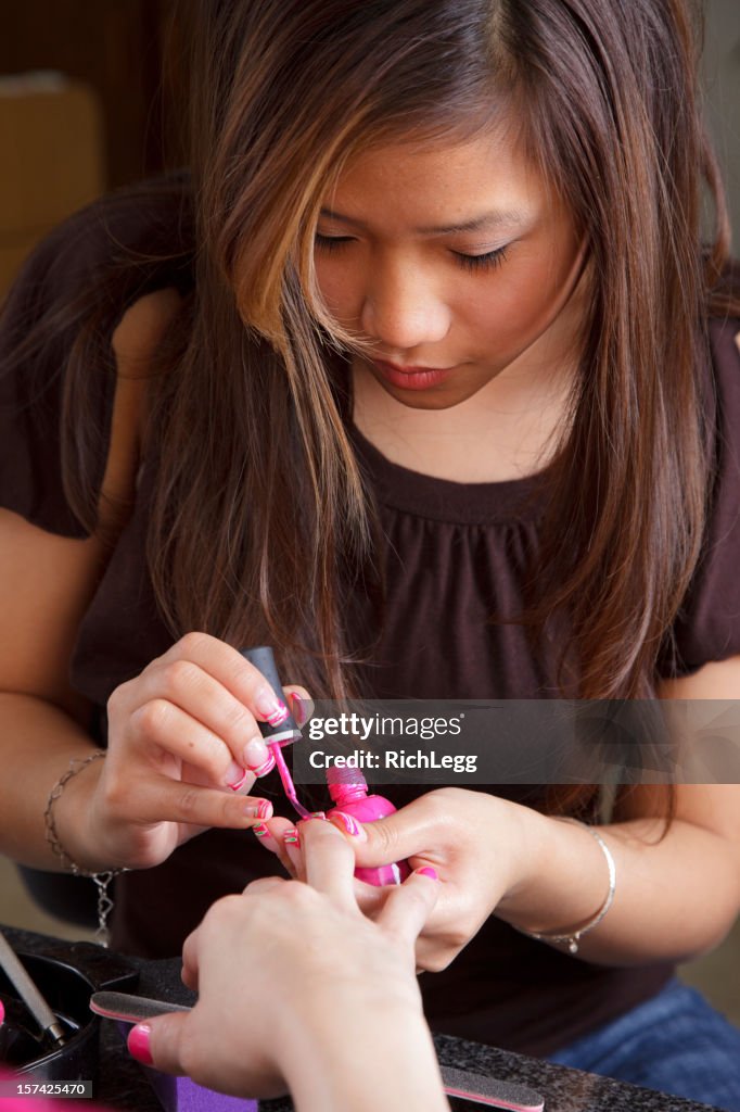 Woman Giving a Manicure