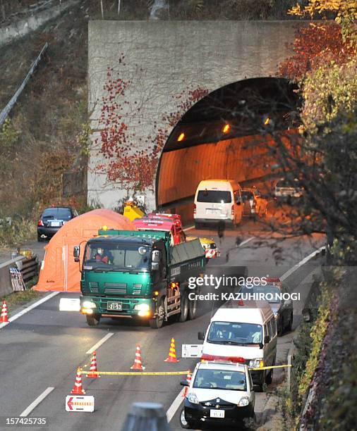 An operation vehicle carries blocks of concrete from the Sasago tunnel along the Chuo highway near the city of Otsuki in Yamanashi prefecture, 80 kms...