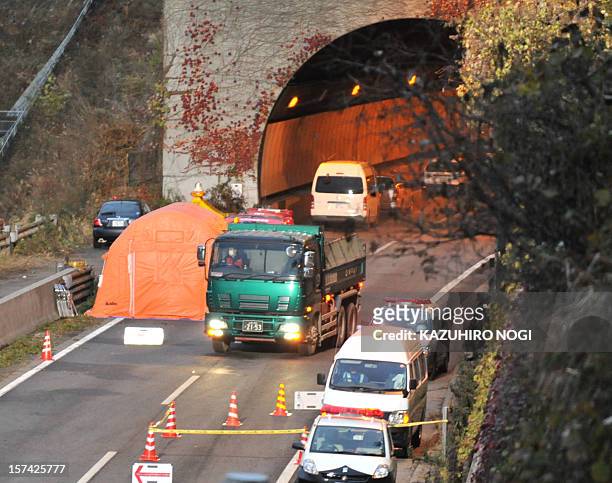 An operation vehicle carries blocks of concrete from the Sasago tunnel along the Chuo highway near the city of Otsuki in Yamanashi prefecture, 80 kms...