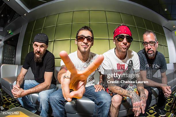 Bassist Robbie Merrill, vocalist Sully Erna, drummer Shannon Larkin and guitarist Tony Rombola of Godsmack pose onboard Shiprocked! cruise on...
