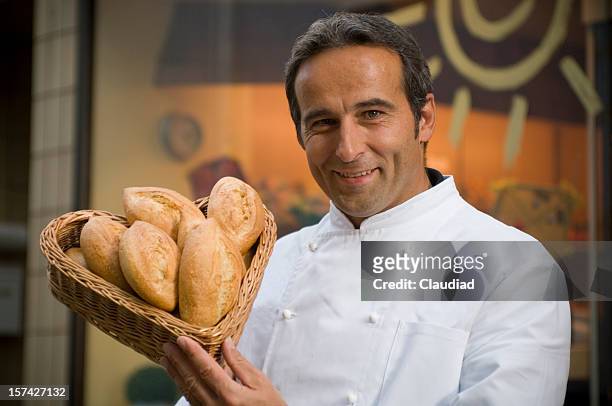 bakery - man offering bread stock pictures, royalty-free photos & images
