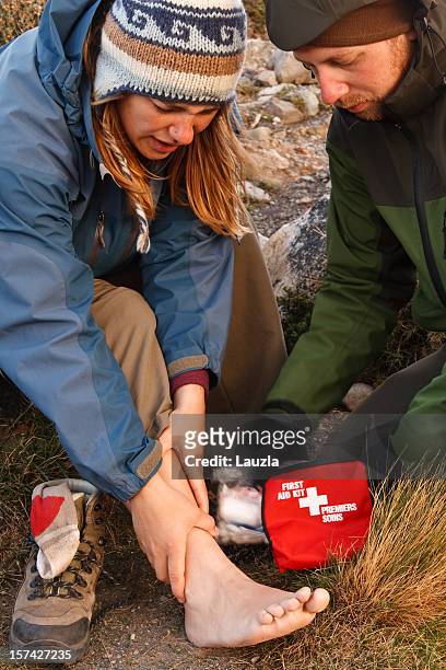 first aid in the wilderness - sprain stock pictures, royalty-free photos & images