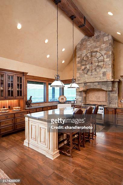 vertical shot of a natural tone kitchen with island - brick arch stock pictures, royalty-free photos & images
