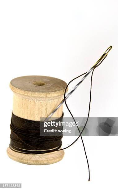 needle, wood spool, and thread - thread sewing item stock pictures, royalty-free photos & images