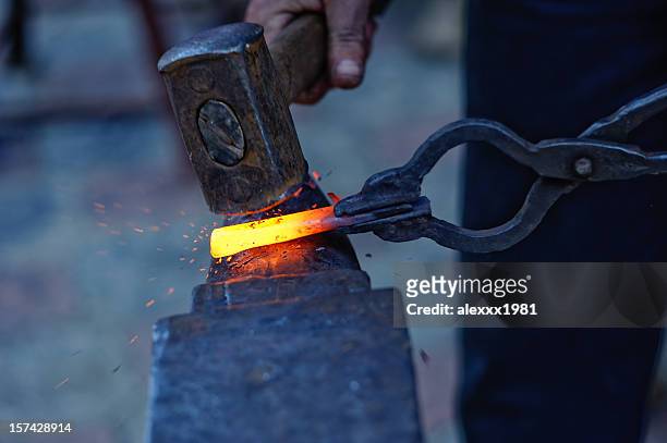 blacksmith at work - metal hammer stock pictures, royalty-free photos & images