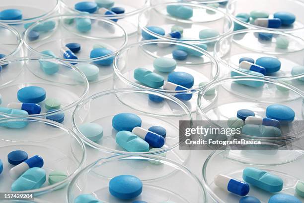 blue pills - pills stock pictures, royalty-free photos & images