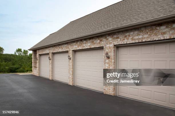 clean tidy brick four stall garage attached to house - brick house door stock pictures, royalty-free photos & images