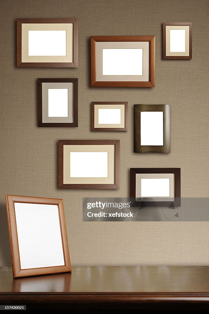 Various sizes of blank wooden picture frames hanging