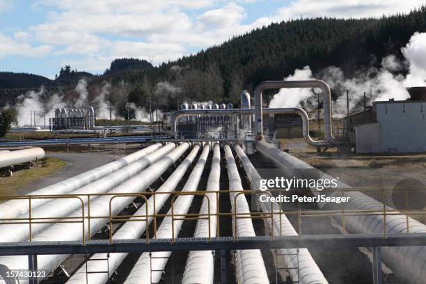 steam pipes at a geothermal power station - jordvärmekraftverk bildbanksfoton och bilder