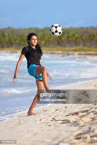 barefoot soccer girl controlling the ball - teen girl barefoot stock pictures, royalty-free photos & images