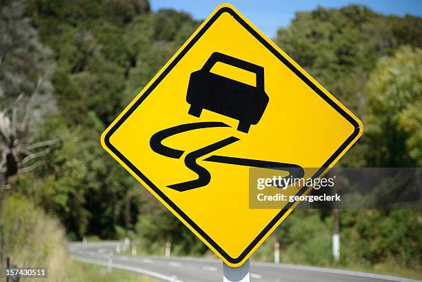 winding road sign - swerving car stock pictures, royalty-free photos & images