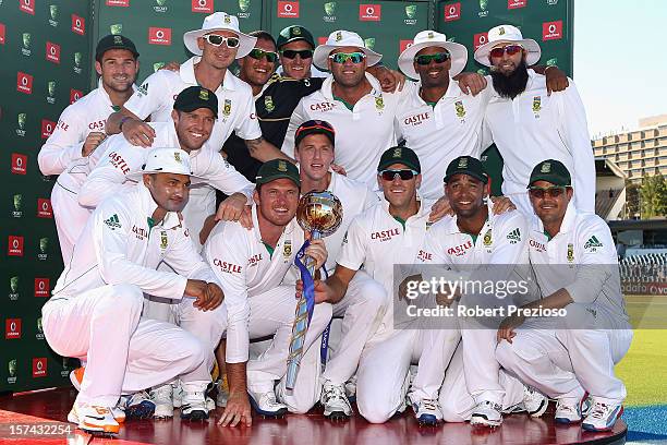 The South African team pose after South Africa defeated Australia on day four of the Third Test Match between Australia and South Africa at the WACA...