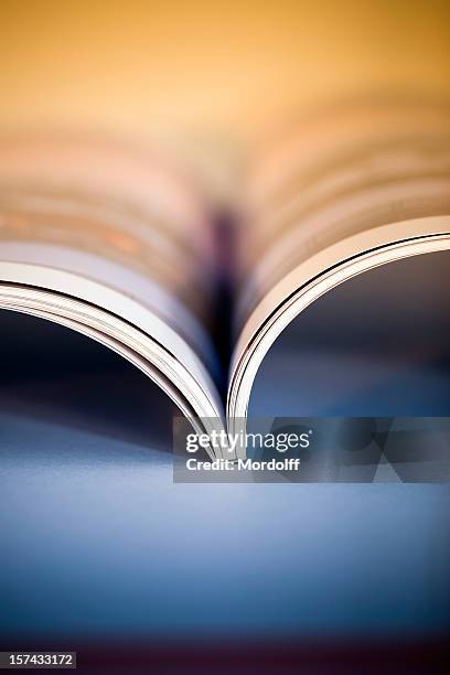 open illustrated magazine - glossy table stock pictures, royalty-free photos & images