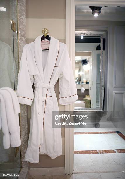 plush robe in fancy hotel room - terry cloth stock pictures, royalty-free photos & images