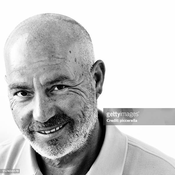 a wise bald happy man posing for a photo - black and white stock pictures, royalty-free photos & images