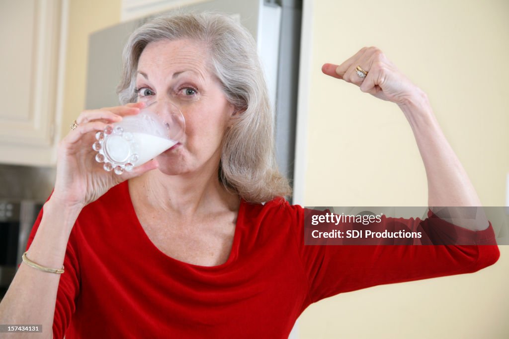 Senior Adult Female Staying Strong by Drinking Milk