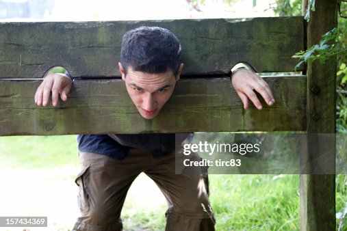 Man in medieval stocks