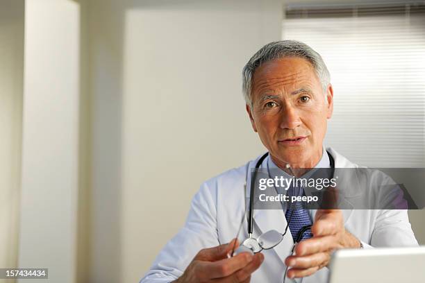 doctor - talking head stock pictures, royalty-free photos & images