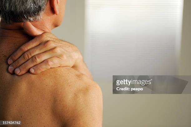 senior with neck pain - shoulder anatomy stock pictures, royalty-free photos & images