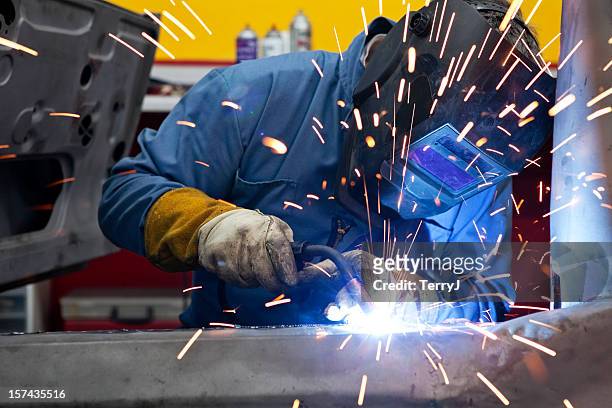 welder uses torch on car he is welding - shipbuilders stock pictures, royalty-free photos & images