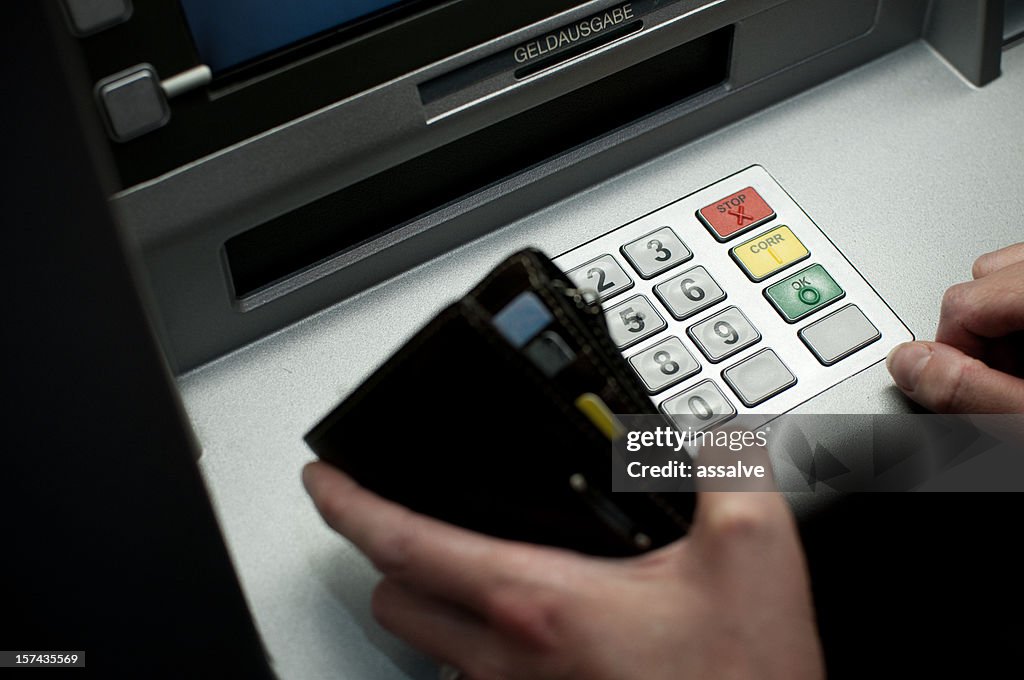 Cash Machine Secret Code Tiping The Code On A Cash Dispenser Atm High-Res Stock Photo - Getty Images