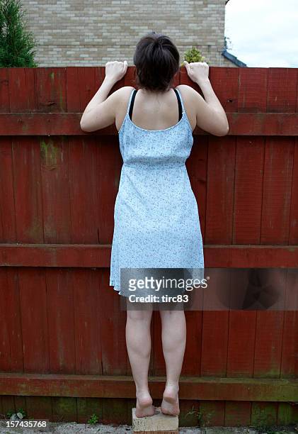 nosey neighbour - nosy woman stock pictures, royalty-free photos & images