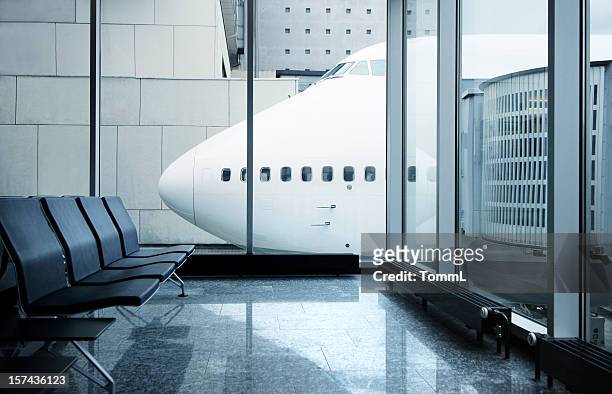 airport lounge with airplane - airport terminal stock pictures, royalty-free photos & images