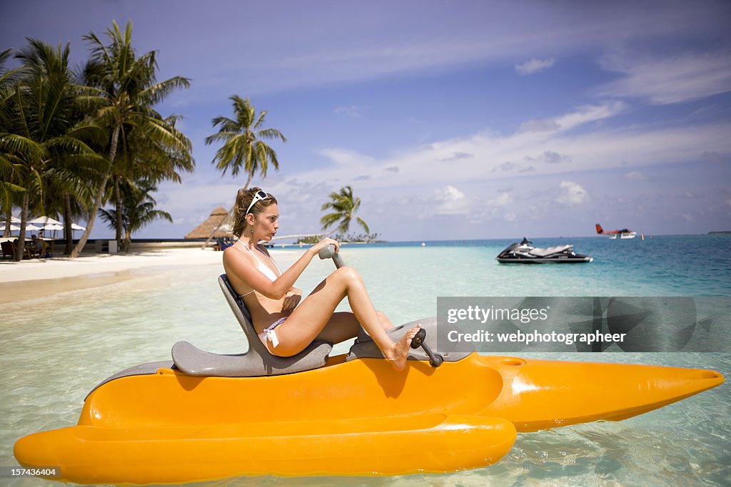 Woman in paddle boat