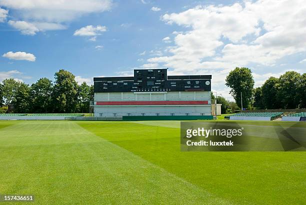 cricket field stadion with score board - cricket stock pictures, royalty-free photos & images