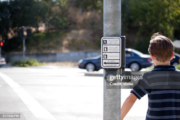 child crossing the street - pedestrian safety stock pictures, royalty-free photos & images