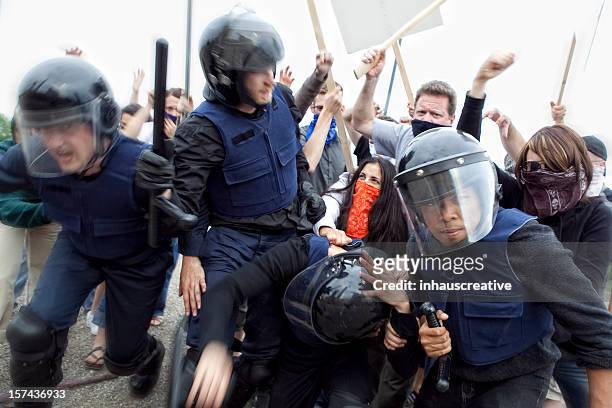 riot police fight angry mob - riot stock pictures, royalty-free photos & images