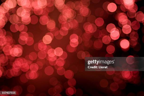 defocused red holiday background. - christmas background no people stock pictures, royalty-free photos & images