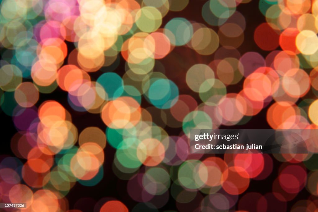 Mulitcolored defocused light dots nice background