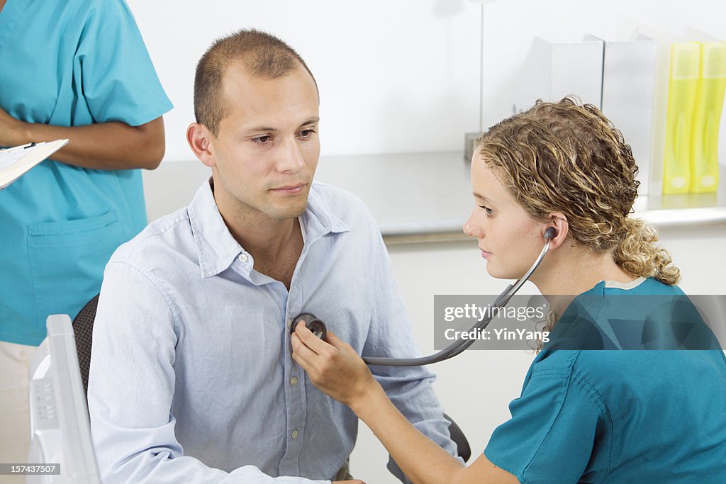 Hispanic Patient with Doctor, Nurse in Medical Exam with Stethoscope