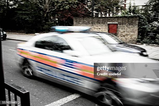 police car chase, blurred motion in city street - sought stock pictures, royalty-free photos & images