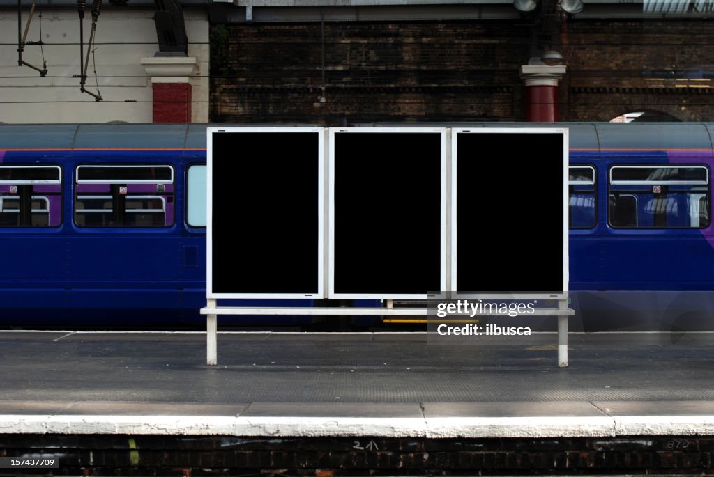 Blank billboard in train station