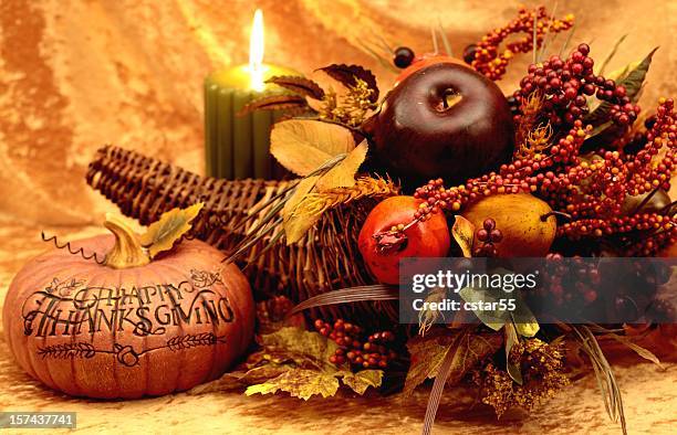 holiday: happy thanksgiving still life with pumpkin, cornucopia, candle - thanksgiving cornucopia stock pictures, royalty-free photos & images