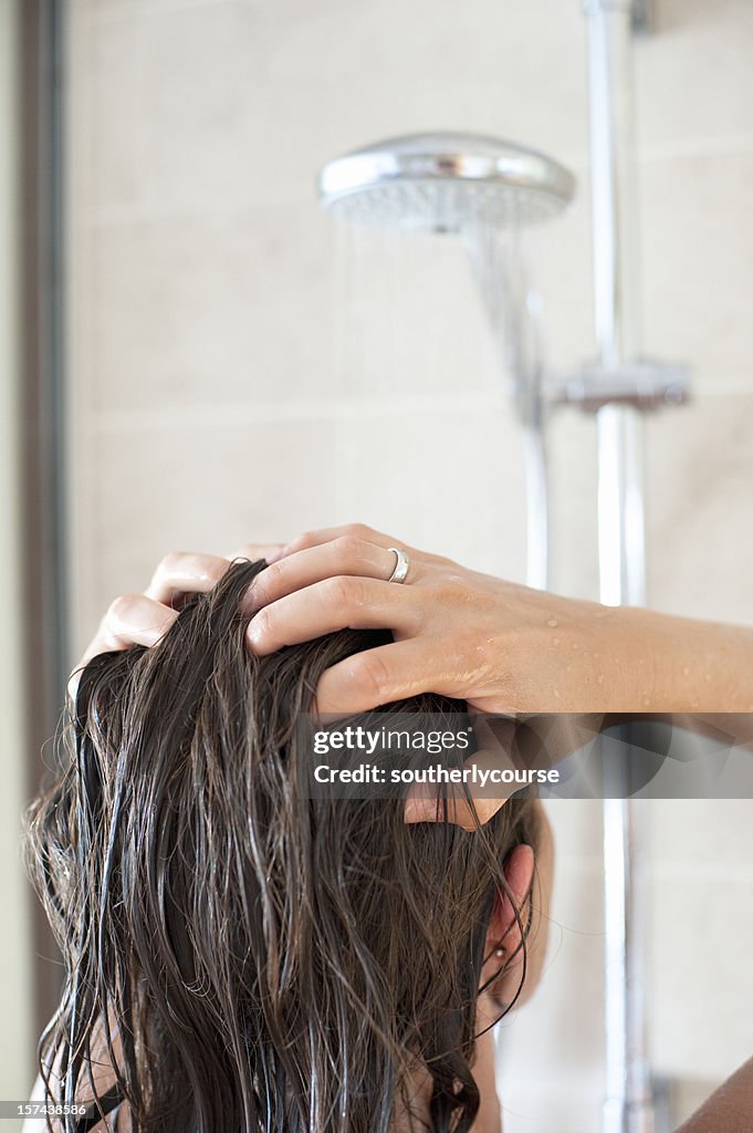Woman in Shower Washing her Hair